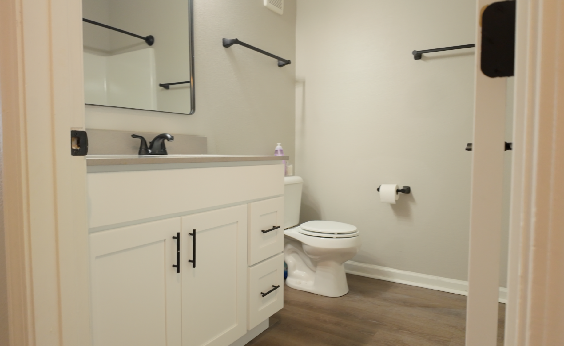 Updated bathroom with white vanity and modern fixtures